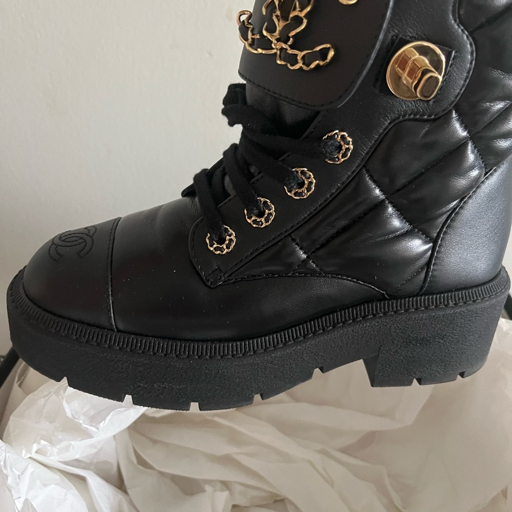CHANEL Black Quilted Combat Boots with Gold Accents